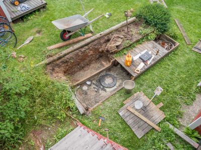 Septic Service Technician inspecting tank